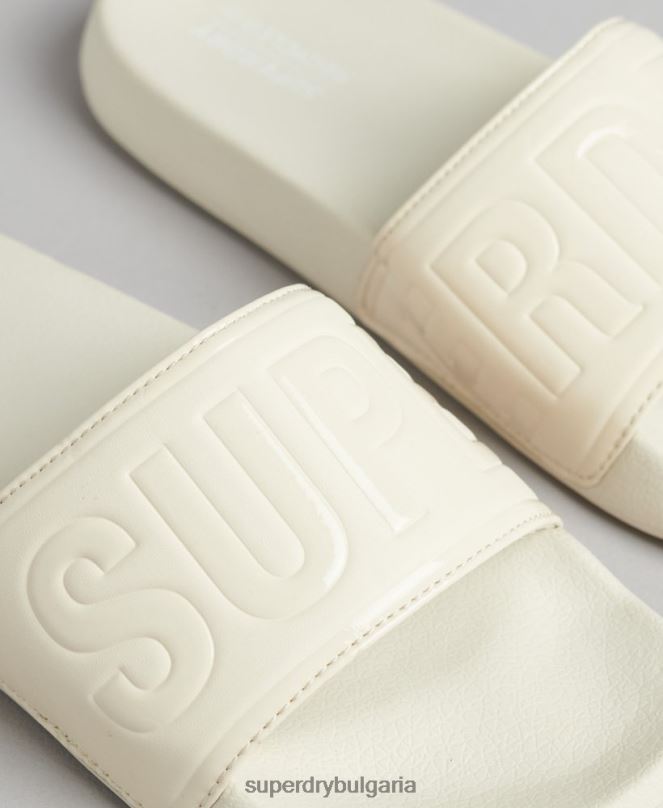 Superdry обувки N00H4390 сметана Жени плъзгачи на основния пул на кода